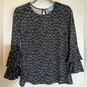 Black blouse w/delicate white ribbon design. Cozy polyester spandex material.